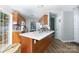 Modern kitchen with white quartz countertops, wood cabinets, stainless steel appliances, and wood floors at 2949 Glenstone Dr, Rock Hill, SC 29730
