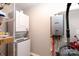 Efficient laundry area with stacked washer and dryer next to modern water heater at 2949 Glenstone Dr, Rock Hill, SC 29730