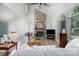 Bright living room with stone fireplace, vaulted ceiling, fan and large windows at 2949 Glenstone Dr, Rock Hill, SC 29730