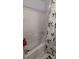 Clean bathtub with a floral shower curtain and tile floors at 311 Wilkes Place Dr, Fort Mill, SC 29715