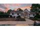 Exterior view of clubhouse with well-maintained landscaping and accessible entrance at 311 Wilkes Place Dr, Fort Mill, SC 29715