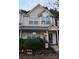Charming townhome featuring a cozy front porch with landscaping and inviting decorations at 311 Wilkes Place Dr, Fort Mill, SC 29715