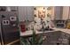 Modern kitchen with stainless steel appliances, floating shelves, and stylish decor at 311 Wilkes Place Dr, Fort Mill, SC 29715