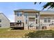 Backyard featuring a wood deck and well-maintained siding, ideal for outdoor living at 4520 Buck Skin Ct, Fort Mill, SC 29707
