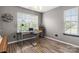 Comfortable bedroom featuring a desk, large window, and neutral decor at 4520 Buck Skin Ct, Fort Mill, SC 29707