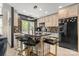Well-equipped kitchen with an island, barstool seating, modern appliances and ample cabinetry at 4520 Buck Skin Ct, Fort Mill, SC 29707