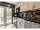 Contemporary kitchen with stainless steel appliances, chic backsplash, and a door to the backyard at 4520 Buck Skin Ct, Fort Mill, SC 29707