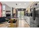 Well-equipped kitchen with an island, barstool seating, modern appliances and ample cabinetry at 4520 Buck Skin Ct, Fort Mill, SC 29707