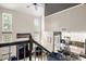 Elevated view of the living room, showcasing the kitchen, fireplace, and natural light at 4520 Buck Skin Ct, Fort Mill, SC 29707