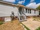 Home back entrance featuring a convenient entrance with stairs and access to utilities at 4833 Verde View Dr, Gastonia, NC 28056