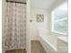 Modern bathroom featuring sleek shower curtain and a built-in tub at 4833 Verde View Dr, Gastonia, NC 28056