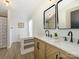 Elegant bathroom with double sinks, chevron cabinetry and modern fixtures at 4833 Verde View Dr, Gastonia, NC 28056