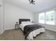 Cozy bedroom features board and batten accent wall and plush carpeting at 4833 Verde View Dr, Gastonia, NC 28056