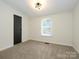 A bright bedroom features plush carpeting and plenty of natural light at 4833 Verde View Dr, Gastonia, NC 28056