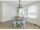 Bright dining area with modern light fixture and matching blue chairs at 4833 Verde View Dr, Gastonia, NC 28056