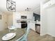 Modern kitchen with white cabinets, stainless steel appliances, and a stylish breakfast nook at 4833 Verde View Dr, Gastonia, NC 28056