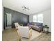Inviting living room with stylish furniture, natural light, and a modern ceiling fixture at 4833 Verde View Dr, Gastonia, NC 28056