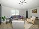 Comfortable living room featuring modern décor, a cozy sofa, and an abundance of natural light at 4833 Verde View Dr, Gastonia, NC 28056