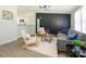 Bright living room with modern decor, wood floors, and comfortable seating arrangement with views to kitchen at 4833 Verde View Dr, Gastonia, NC 28056