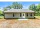 Backyard of house featuring gray siding and a concrete patio at 671 Sylvan Sw St, Concord, NC 28025