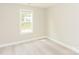 Bright bedroom with a large window providing natural light and green outdoor views at 671 Sylvan Sw St, Concord, NC 28025