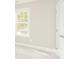 Serene bedroom features carpet floors, a well-lit window, and a closet door at 671 Sylvan Sw St, Concord, NC 28025