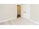 Neutral bedroom featuring plush carpet and two white paneled doors at 671 Sylvan Sw St, Concord, NC 28025