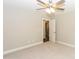 Cozy bedroom with a ceiling fan, plush carpet, and easy access to other rooms through an open doorway at 671 Sylvan Sw St, Concord, NC 28025