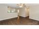This open-concept living room features dark hardwood floors and a seamless transition to other rooms at 671 Sylvan Sw St, Concord, NC 28025