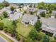 Aerial view of the backyard with a screened in porch and fenced in yard at 7362 Waterwheel Sw St, Concord, NC 28025