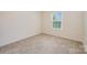 Neutral bedroom features plush carpet, bright window and ample electrical outlets at 7362 Waterwheel Sw St, Concord, NC 28025