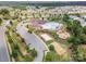 Aerial view of the community pool, clubhouse, playground and parking lot at 7362 Waterwheel Sw St, Concord, NC 28025
