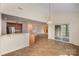 Breakfast area features neutral walls, tile flooring, sliding glass door, with a seamless transition into kitchen at 7362 Waterwheel Sw St, Concord, NC 28025