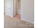 Hallway with access to bathroom and bedroom at 7362 Waterwheel Sw St, Concord, NC 28025