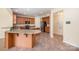 Open kitchen layout with granite countertops, stainless appliances, dual islands and seamless transitions to adjoining spaces at 7362 Waterwheel Sw St, Concord, NC 28025