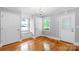 Bright dining room featuring hardwood floors, an elegant chandelier, and a cozy window seat at 810 Lakeview Dr, Pineville, NC 28134