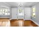 Bright dining room featuring hardwood floors, an elegant chandelier, and a cozy window seat at 810 Lakeview Dr, Pineville, NC 28134