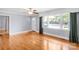 Bright living room featuring hardwood floors, large windows, and a stylish front entrance at 810 Lakeview Dr, Pineville, NC 28134