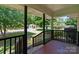 Inviting covered porch with classic railings and a view of the neighborhood at 810 Lakeview Dr, Pineville, NC 28134