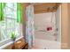 Bright bathroom with shower-tub combination and colorful curtain at 1274 Winding Path Rd, Clover, SC 29710
