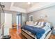 Comfortable bedroom boasting hardwood floors, a plush bed, and a serene ambiance at 1274 Winding Path Rd, Clover, SC 29710