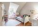 Bright bedroom with lots of natural light, featuring a cozy window seat and carpeted floors at 1274 Winding Path Rd, Clover, SC 29710