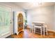 Cozy dining area featuring tile floors, a wooden china cabinet, and a square dining table at 1274 Winding Path Rd, Clover, SC 29710