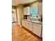 Well-lit kitchen featuring white cabinets, granite countertops, stainless steel sink, and modern appliances at 1274 Winding Path Rd, Clover, SC 29710