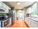 Spacious kitchen with white cabinets, stainless steel appliances, granite countertops and modern lighting at 1274 Winding Path Rd, Clover, SC 29710
