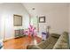 Cozy living room with hardwood flooring, large mirror, and playroom decor at 1274 Winding Path Rd, Clover, SC 29710