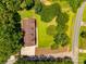 Aerial view of a home with a long driveway, surrounded by lush greenery and trees at 1388 Aragon Beach Rd, Rock Hill, SC 29732