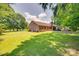 Expansive backyard with lush green lawn and exterior view of the brick home at 1388 Aragon Beach Rd, Rock Hill, SC 29732