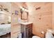 Cozy bathroom with wood paneled walls and modern vanity at 1388 Aragon Beach Rd, Rock Hill, SC 29732