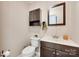 Cozy half bathroom features a modern vanity, matching mirror and neutral wall color at 1388 Aragon Beach Rd, Rock Hill, SC 29732